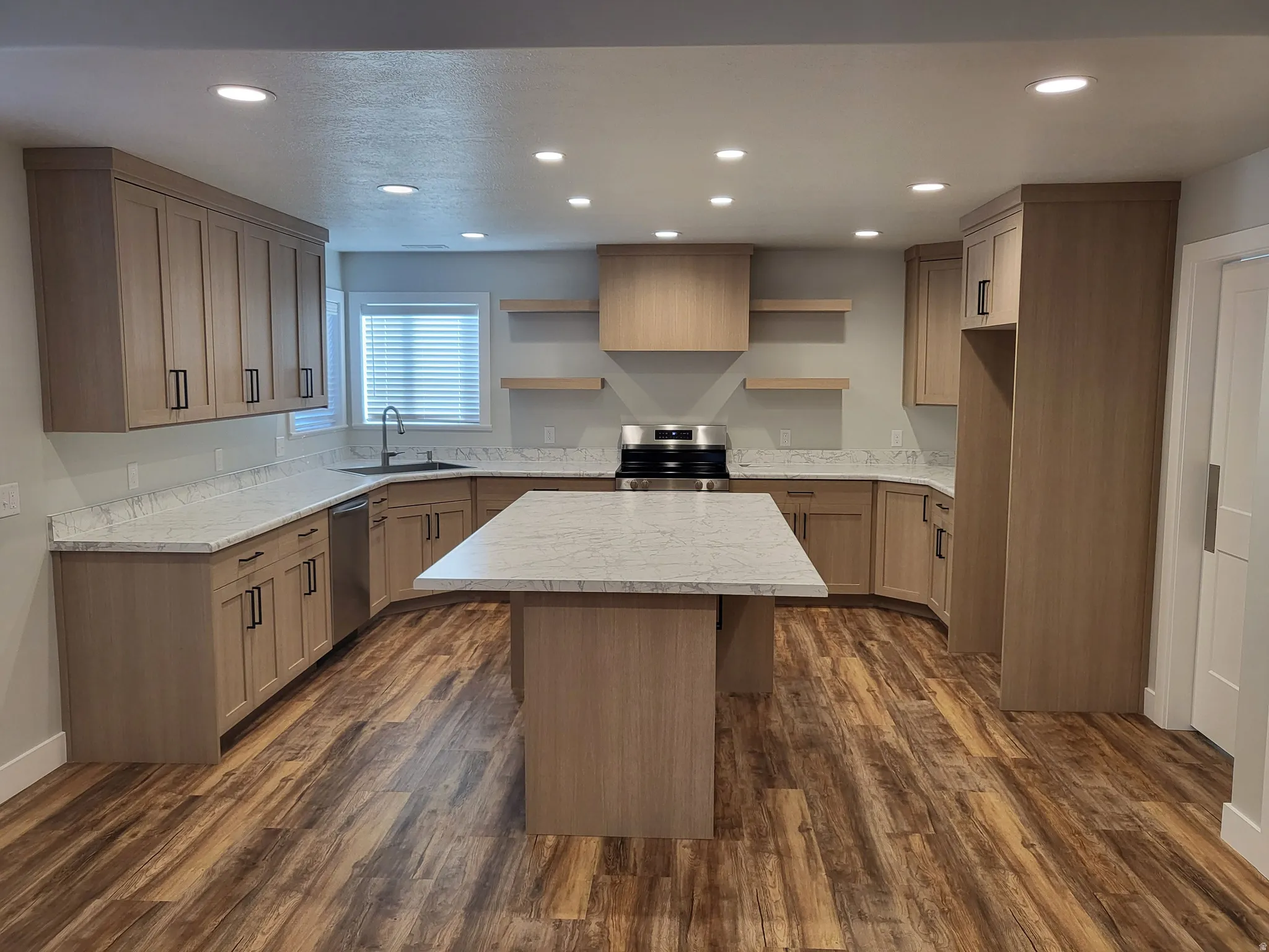 Kitchen featuring open shelves, a kitchen island, stainless steel appliances, recessed lighting, and dark wood-style flooring