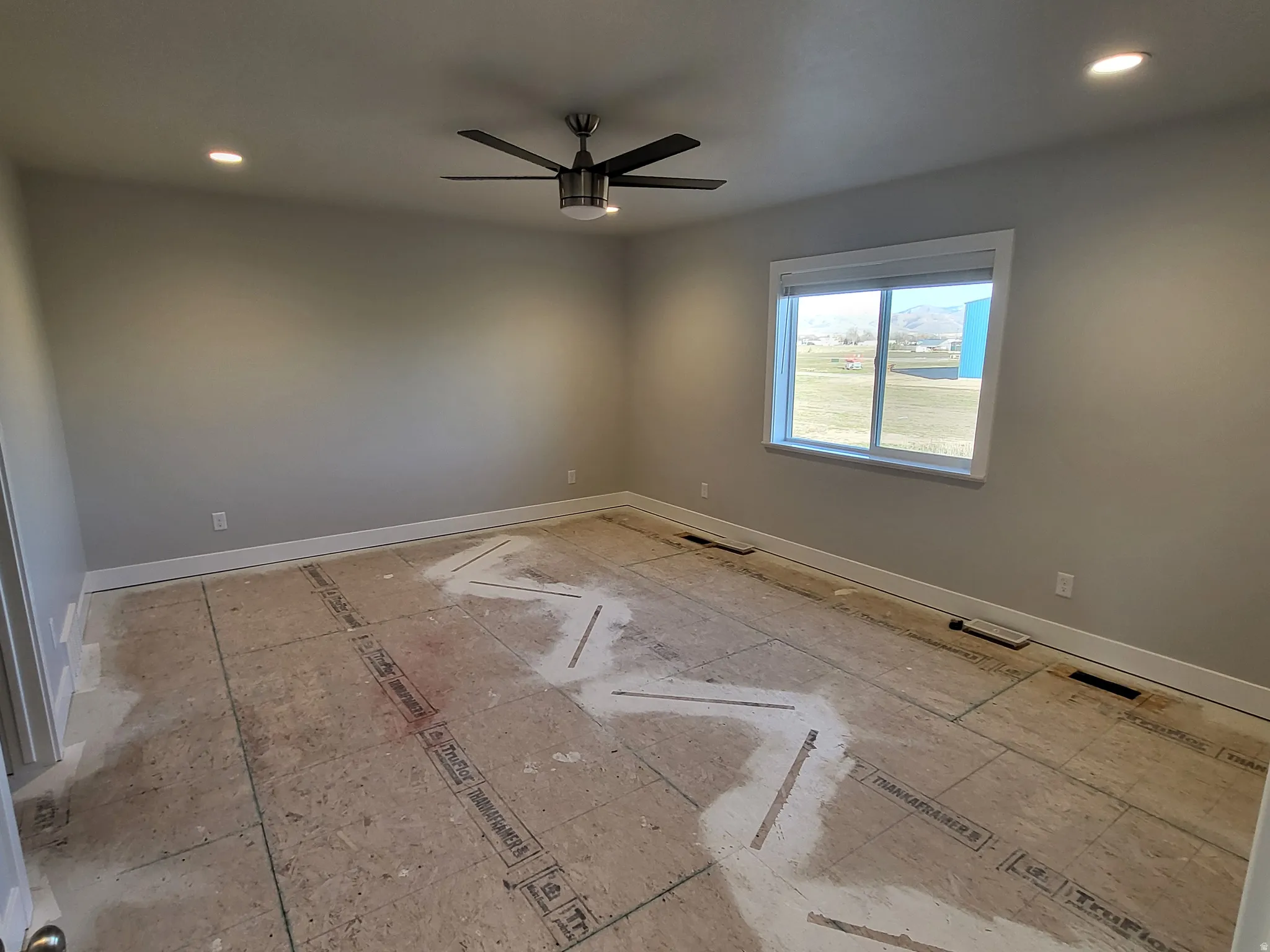 Big Bedroom with recessed lighting and a ceiling fan