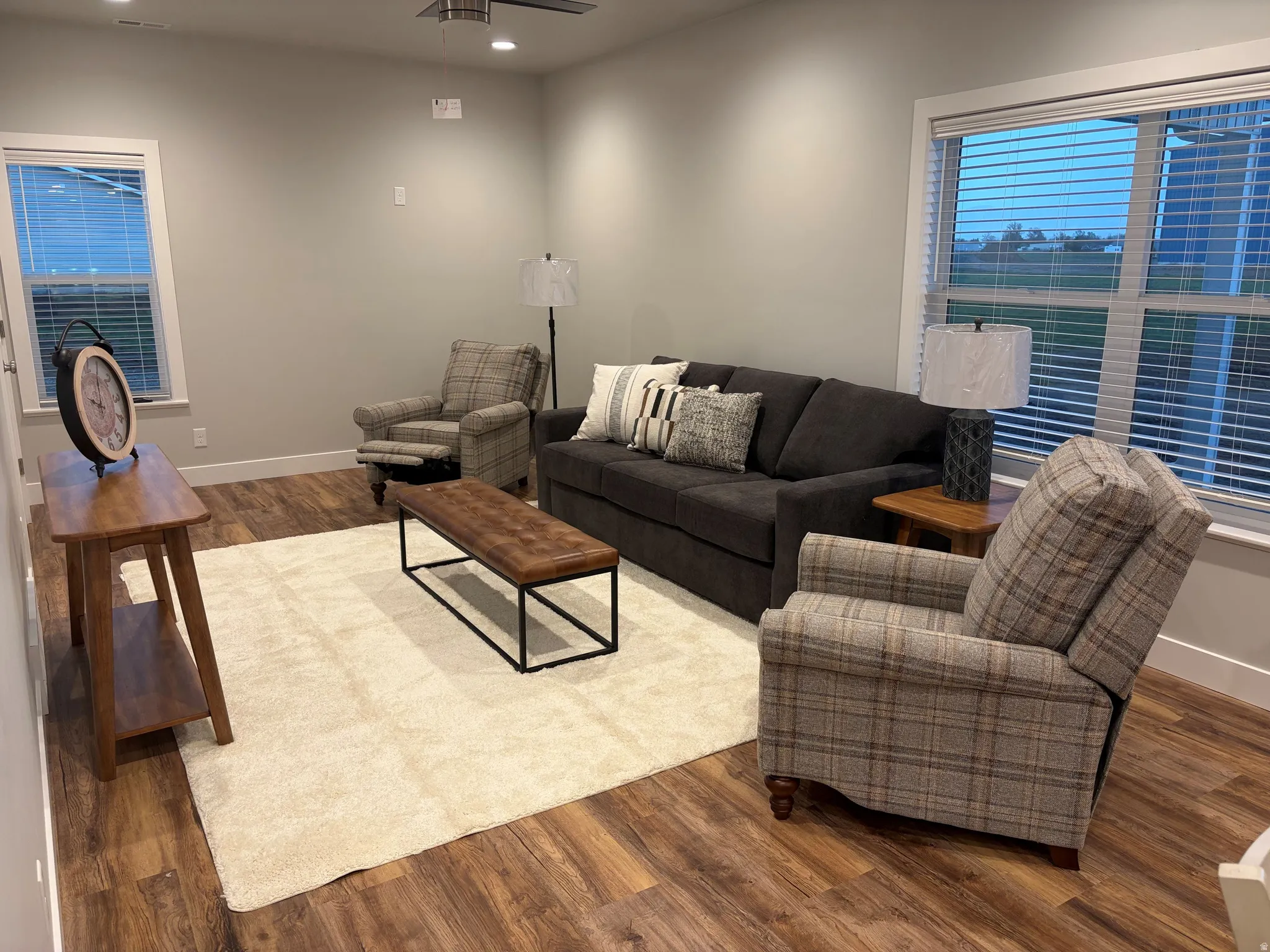 Living room featuring wood finished floors, recessed lighting, and a ceiling fan