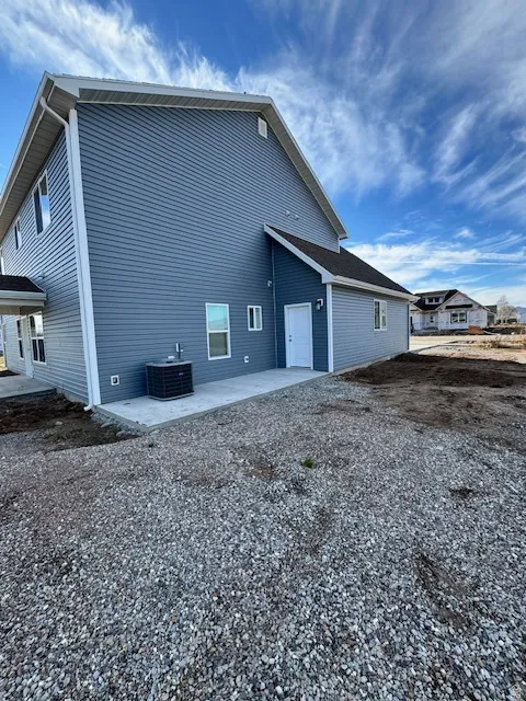 Back of house with a patio area