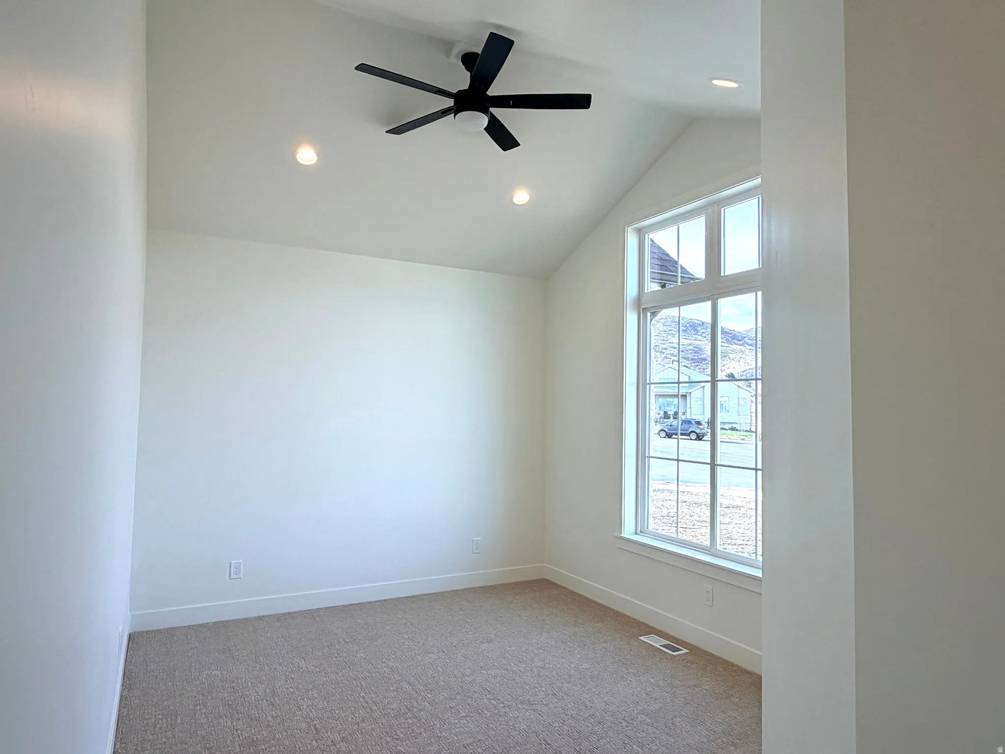 Bedroom #2 with ceiling fan and walk in closet
