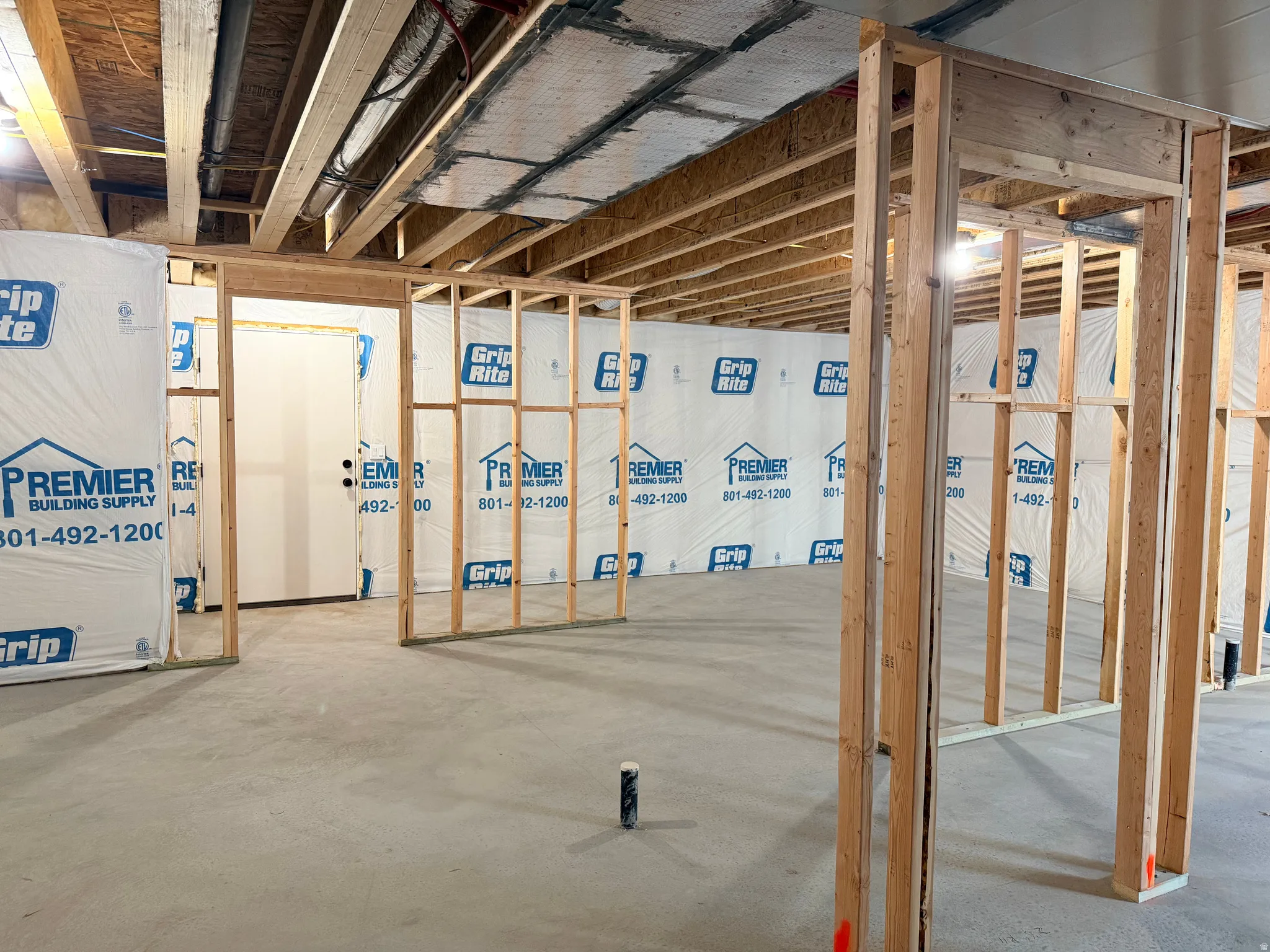View of unfinished basement with walk out