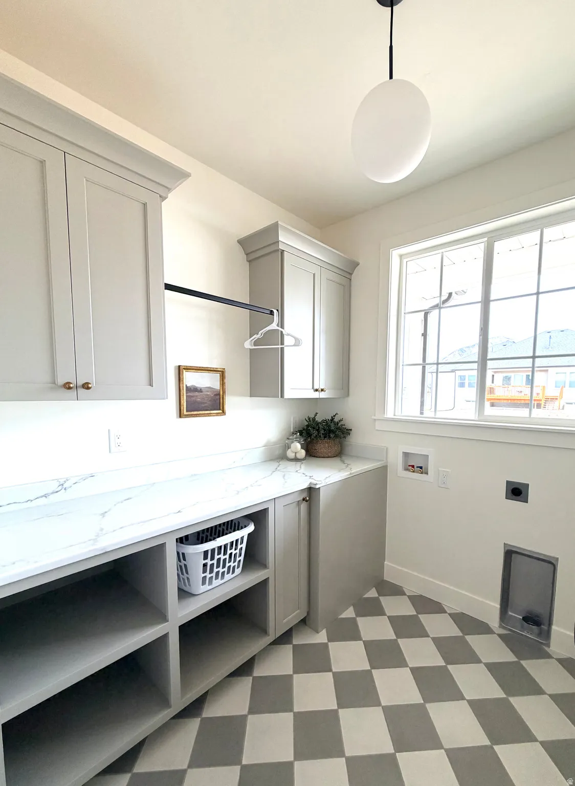 Laundry room, hookup for a washing machine, cabinet space, and hookup for an electric dryer