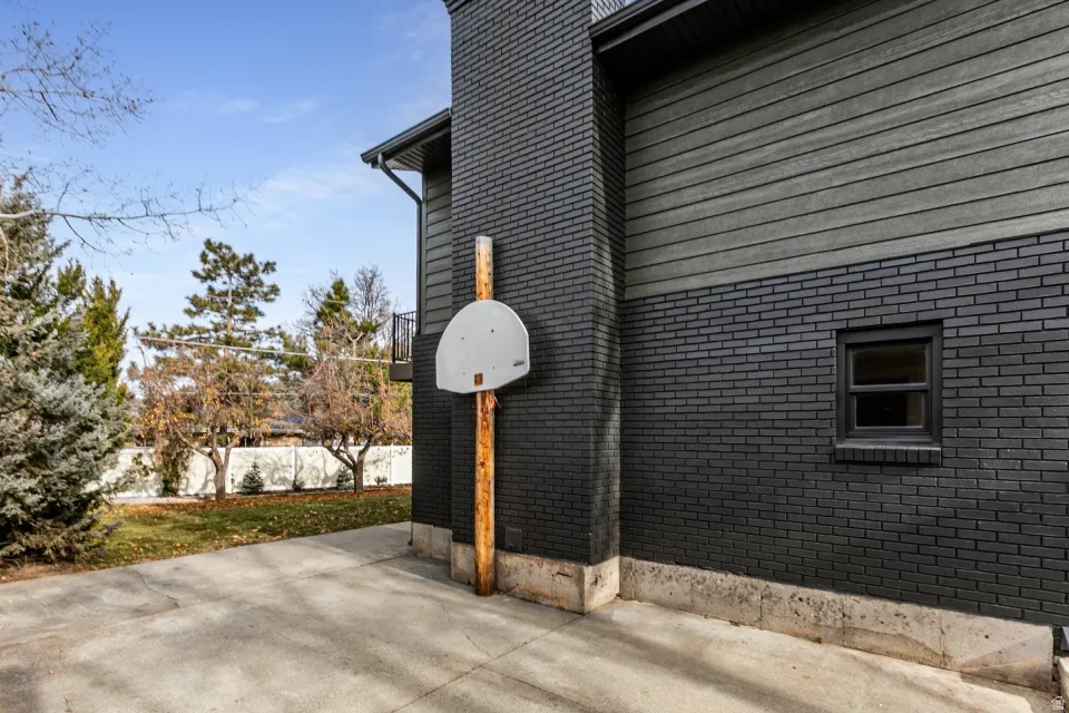 Side of home  Concrete pad for recreation or RV.