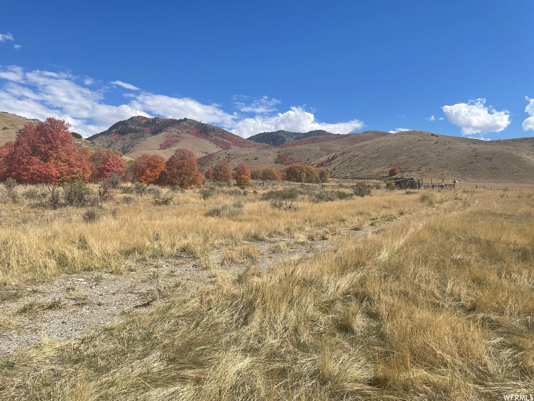 View of mountain backdrop featuring rural landscape