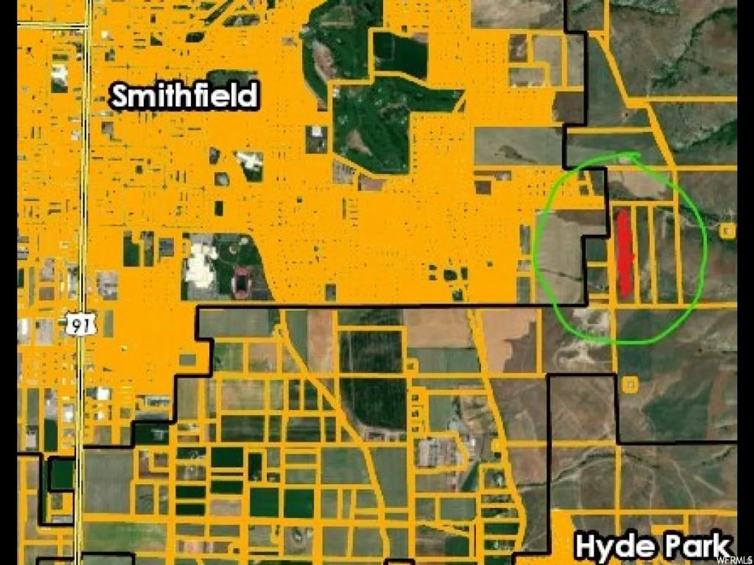 Aerial overview of property's location featuring property parcel outlined