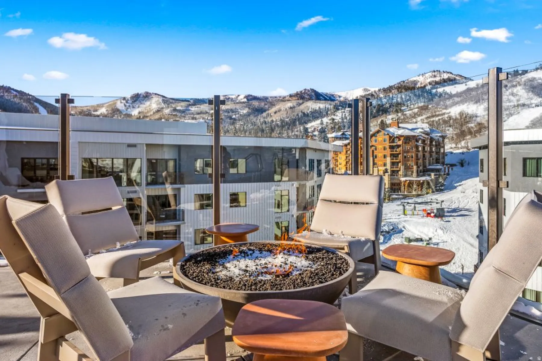 View of patio / terrace featuring a fire pit and a mountain view