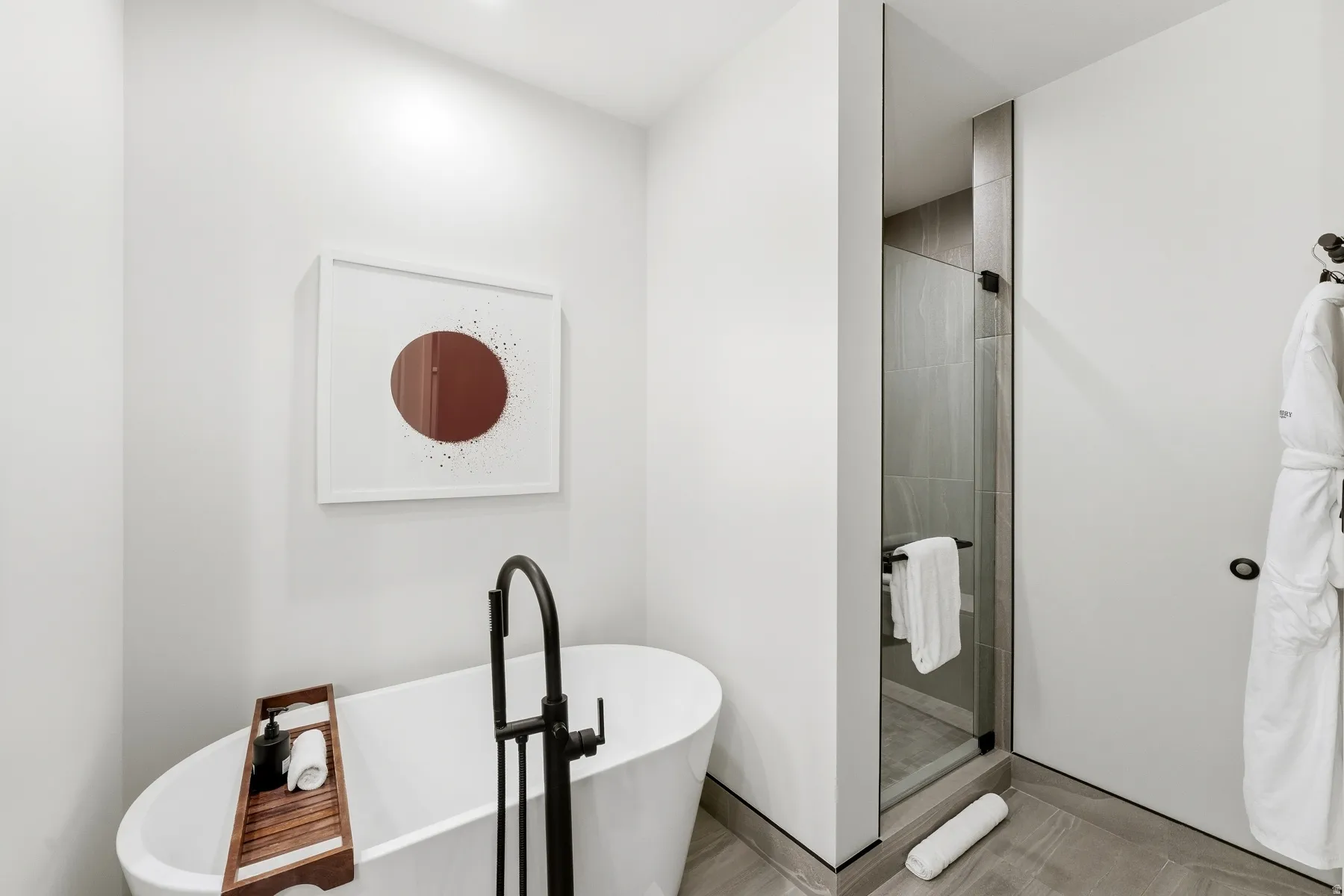Bathroom with a soaking tub and a shower stall