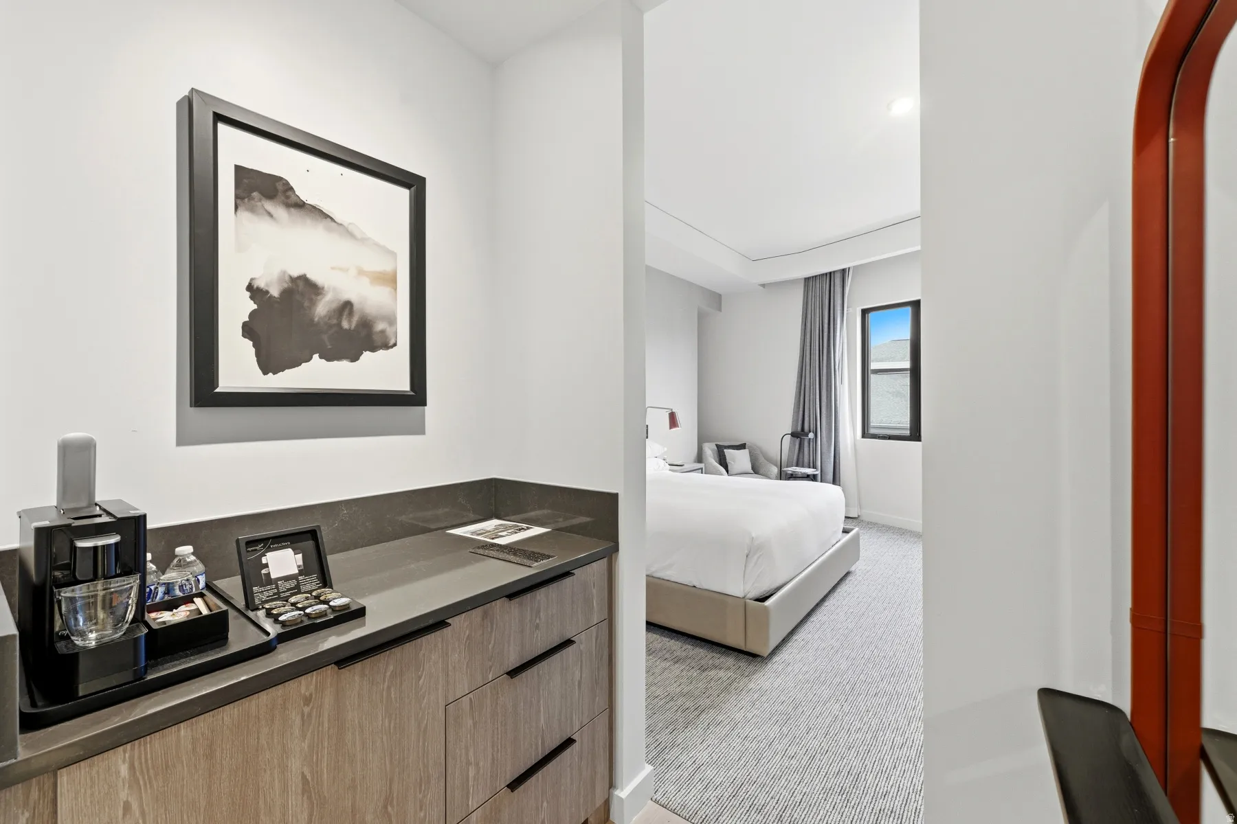 Bedroom featuring light carpet and baseboards