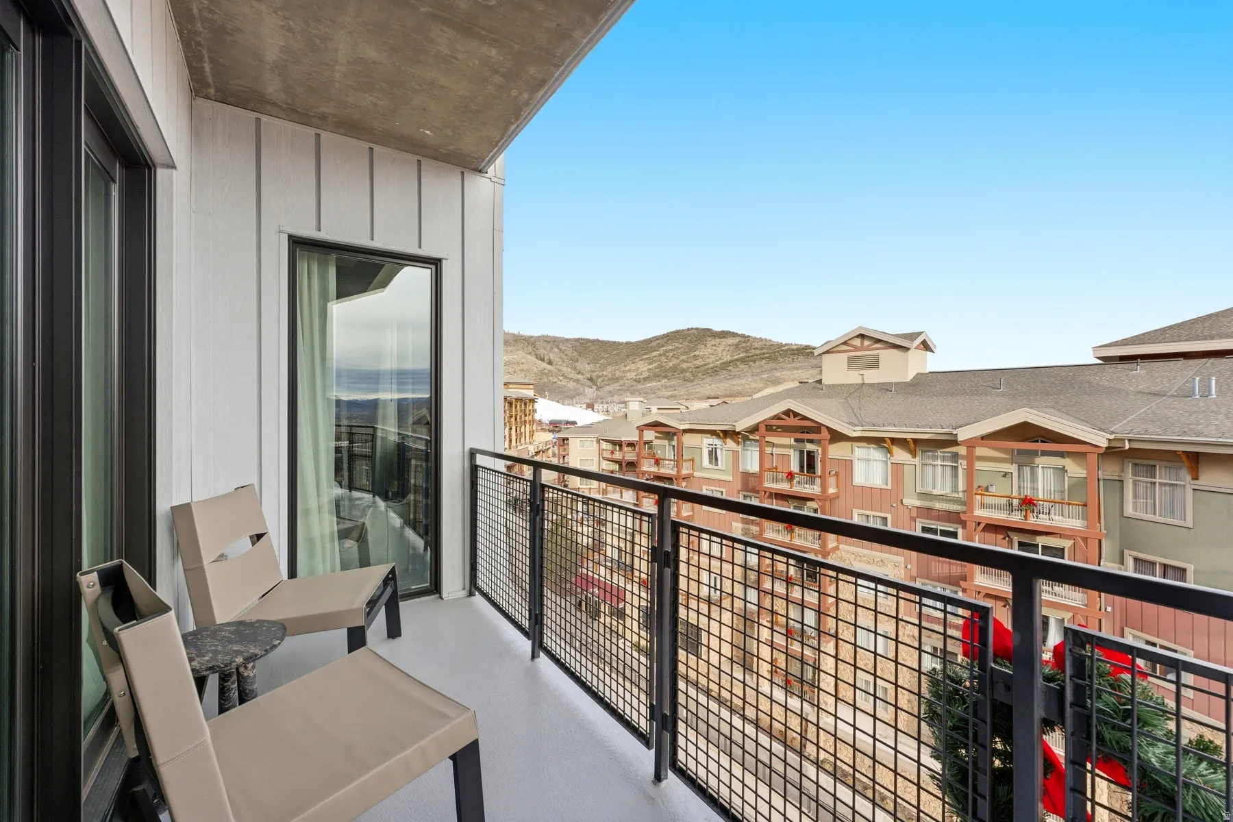 Balcony with a mountain view and a residential view