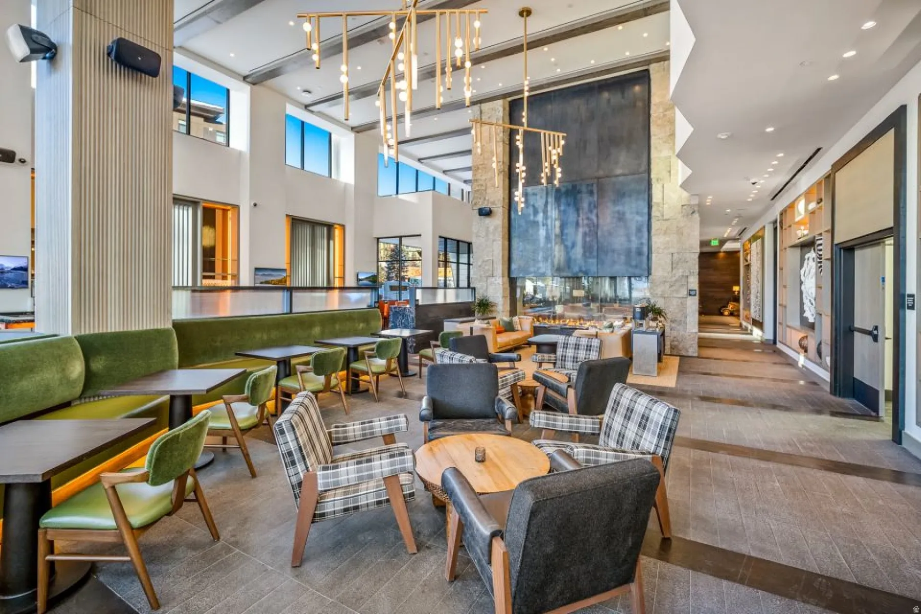 Community lobby with a towering ceiling and recessed lighting