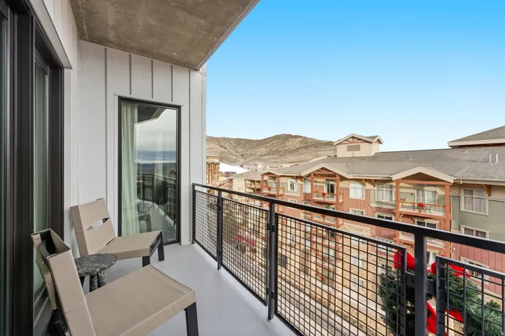 Balcony with a mountain view and a residential view
