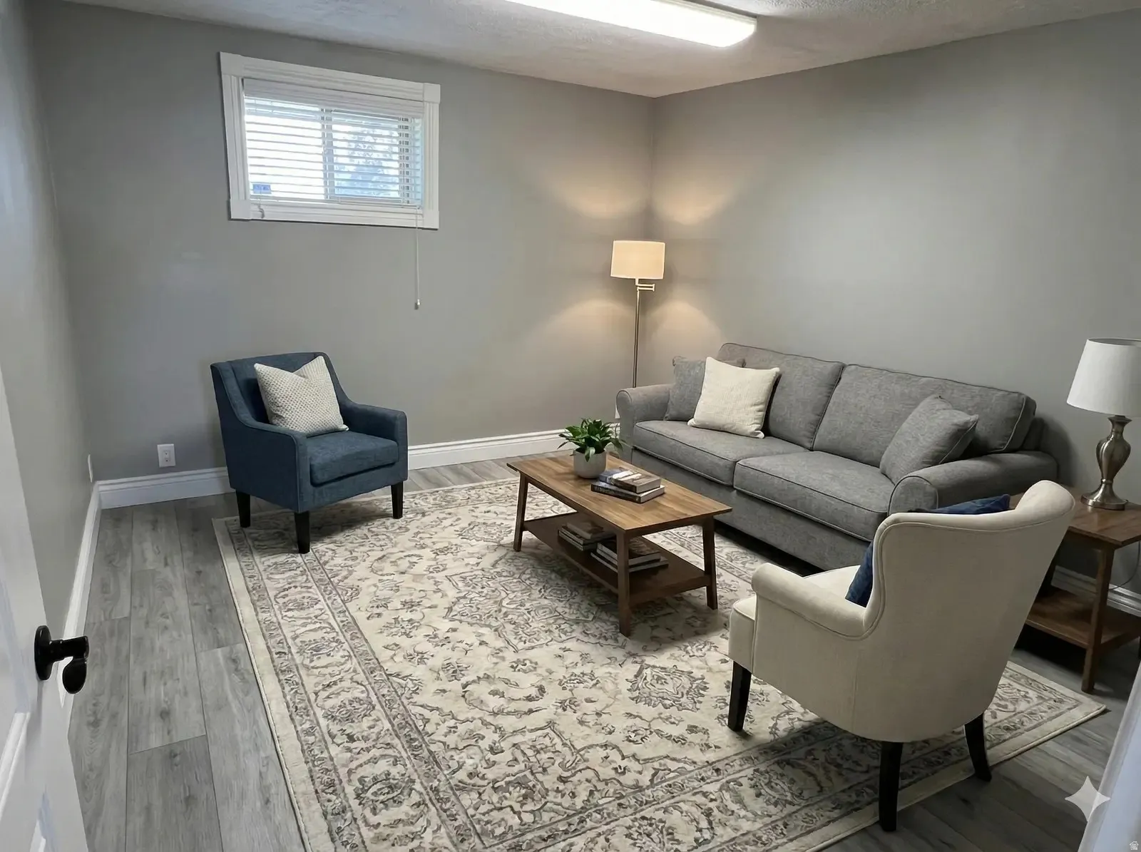 Living room with light wood-style flooring and a textured ceiling