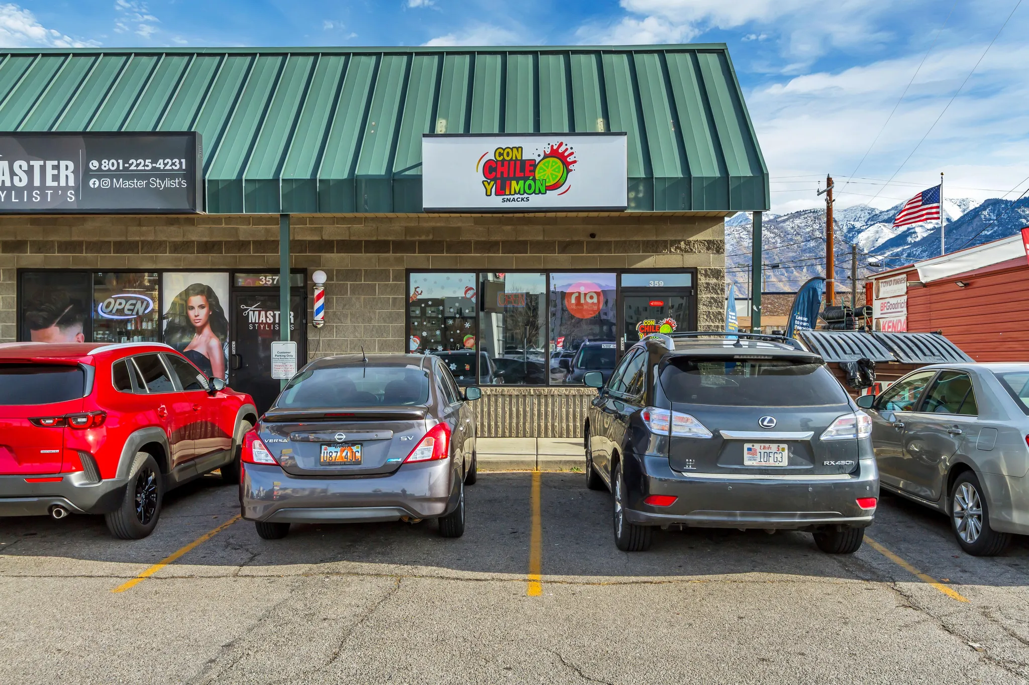 View of building exterior with uncovered parking