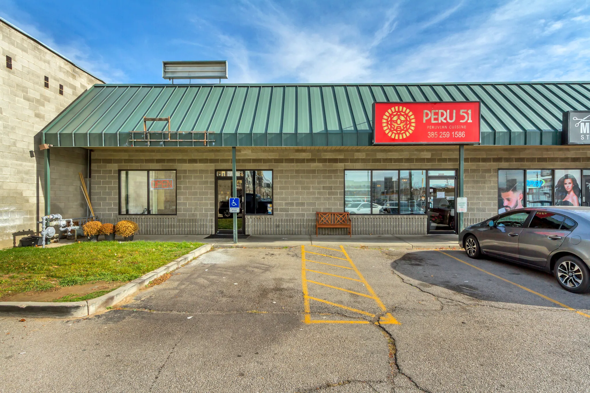 View of commercial location with uncovered parking