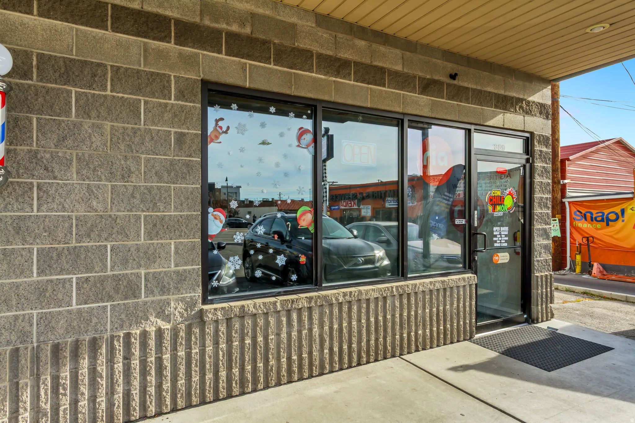 Doorway to property featuring concrete block siding