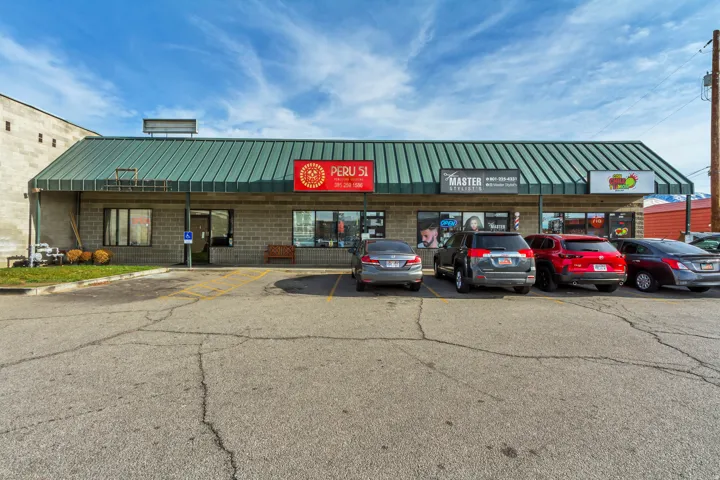 View of commercial location with uncovered parking