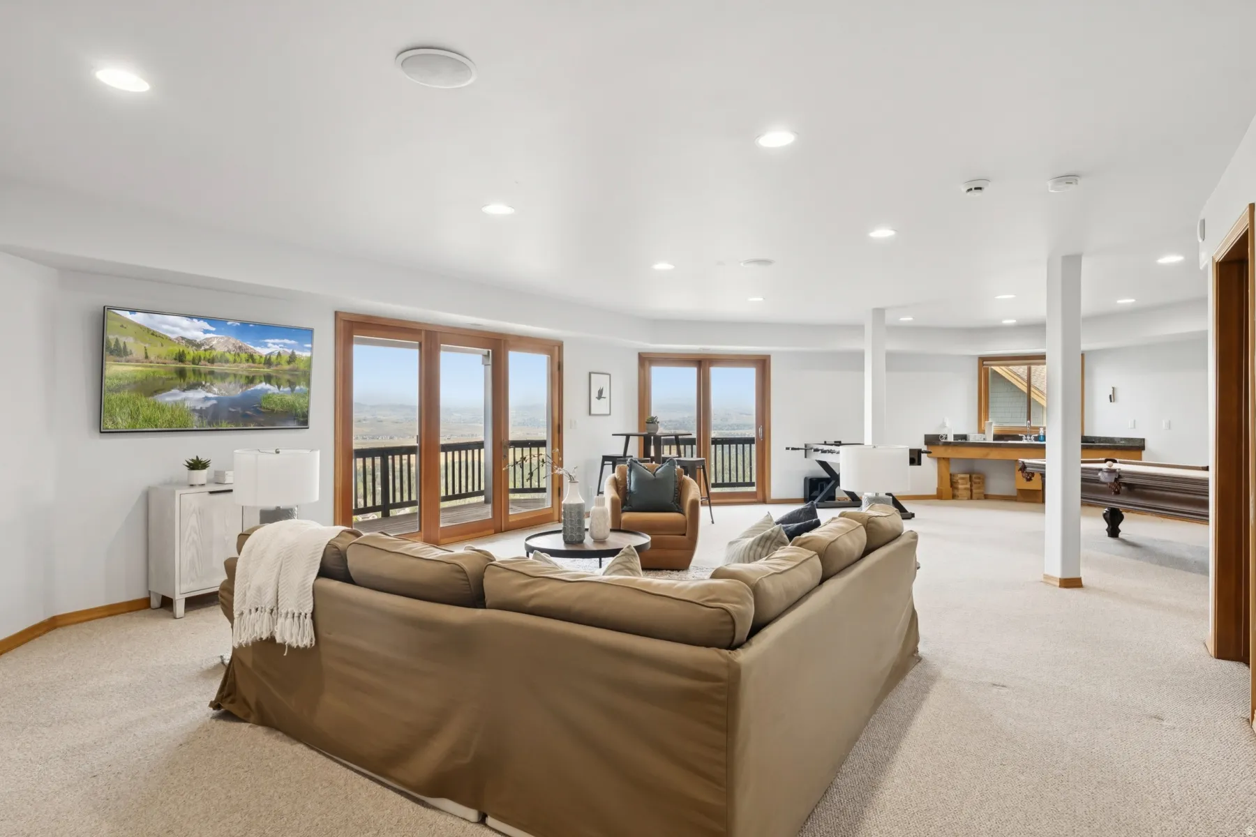 Living area with light carpet, recessed lighting, and pool table