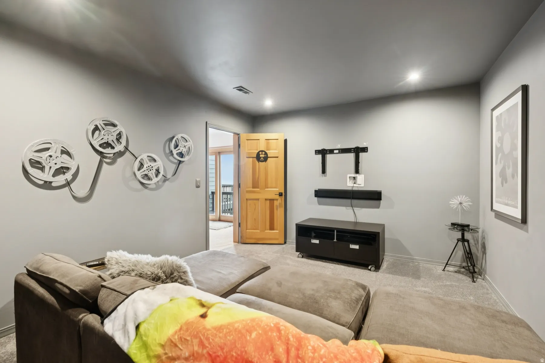 Carpeted living room featuring baseboards and recessed lighting
