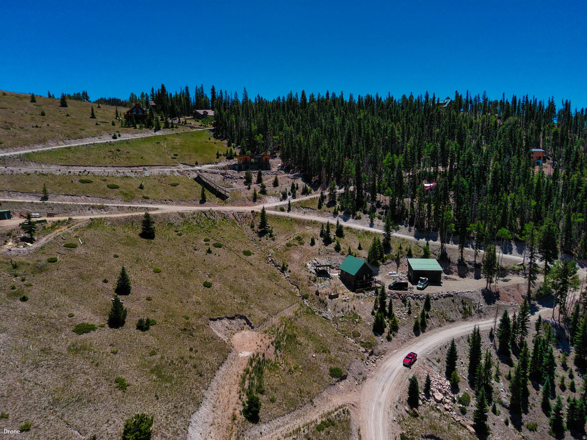 Aerial view of property and surrounding area featuring rural landscape