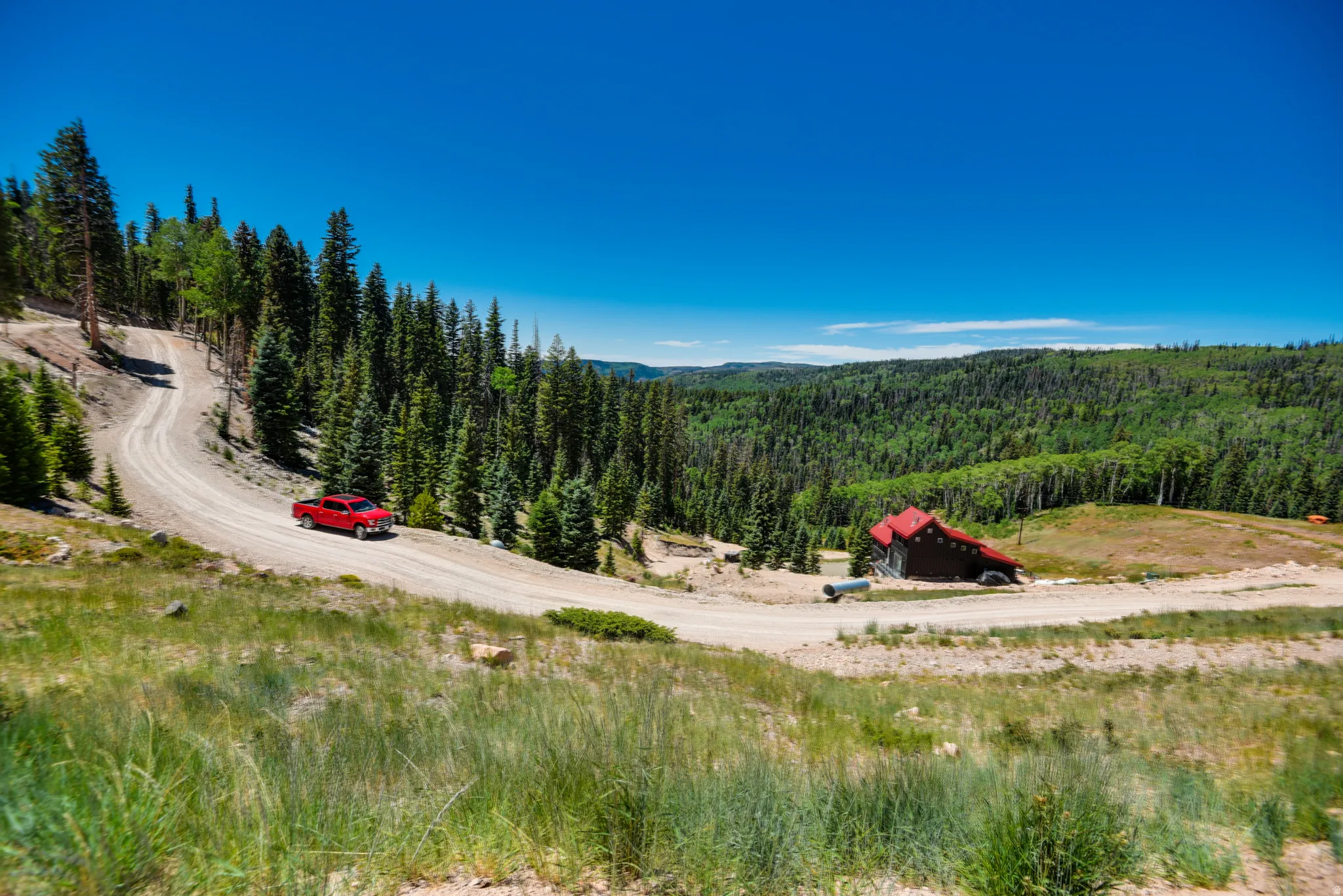 View of mountain background featuring a forest and rural landscape