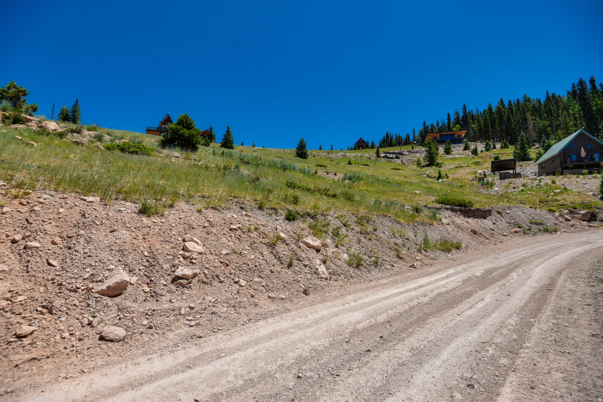 View of dirt / gravel road with a rural view