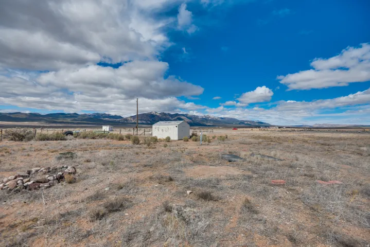 View of mountain backdrop with rural landscape