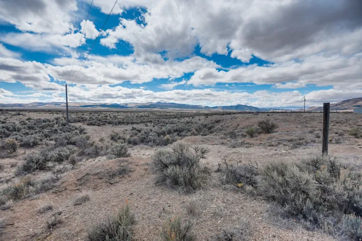 View of mountain backdrop featuring a desert landscape