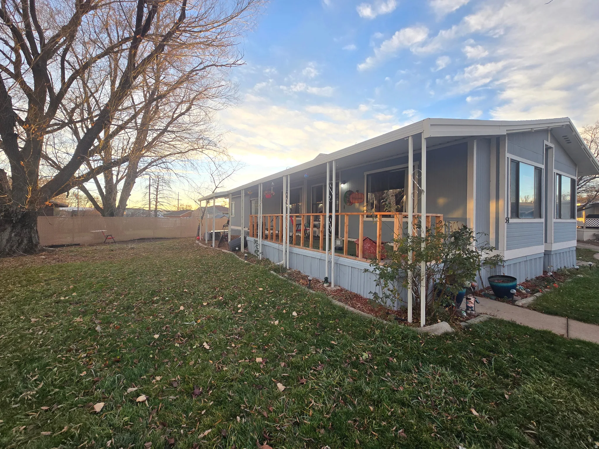 View of property exterior featuring a sunroom