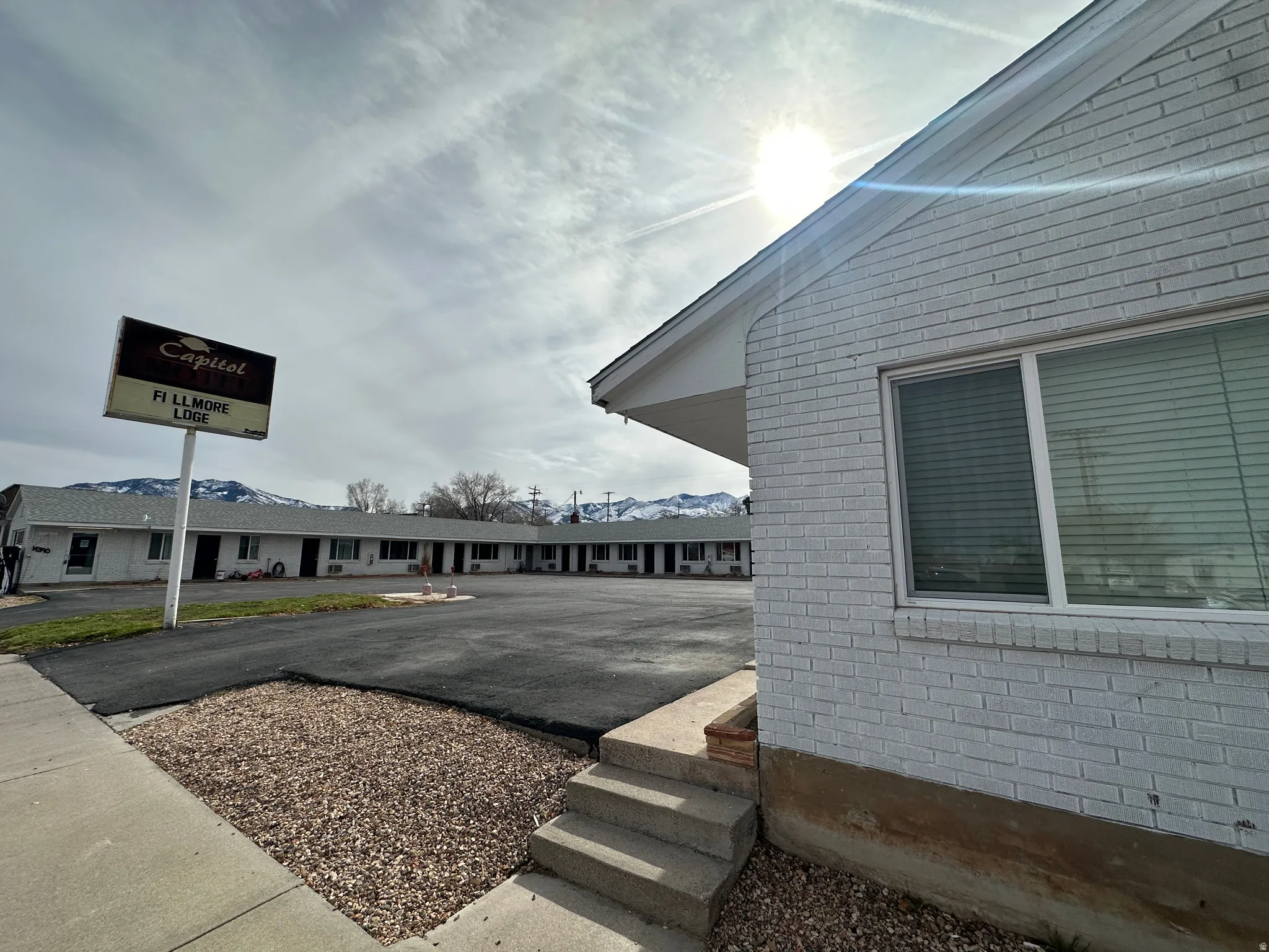 View of home's exterior with a residential view and brick siding
