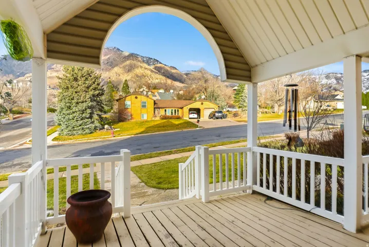 Porch featuring a mountain view and a residential view