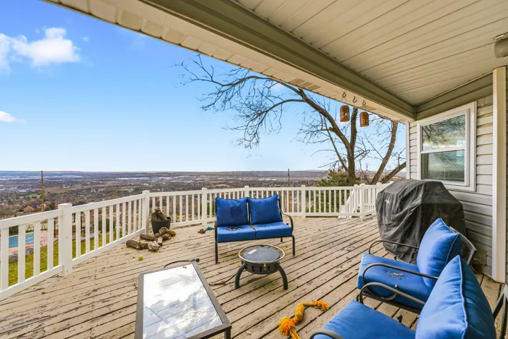 Wooden deck with outdoor lounge area and area for grilling