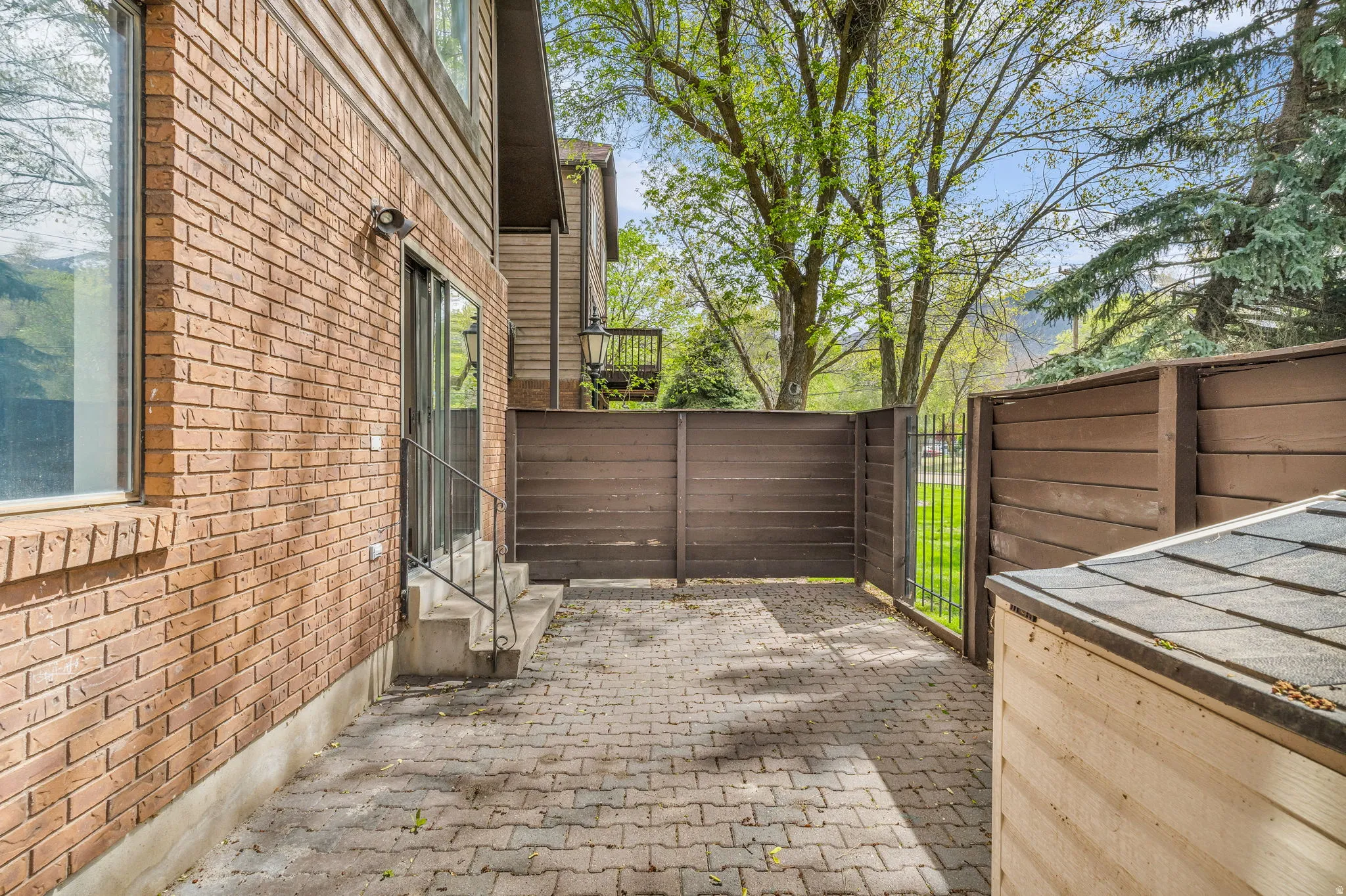 View of patio with a gate