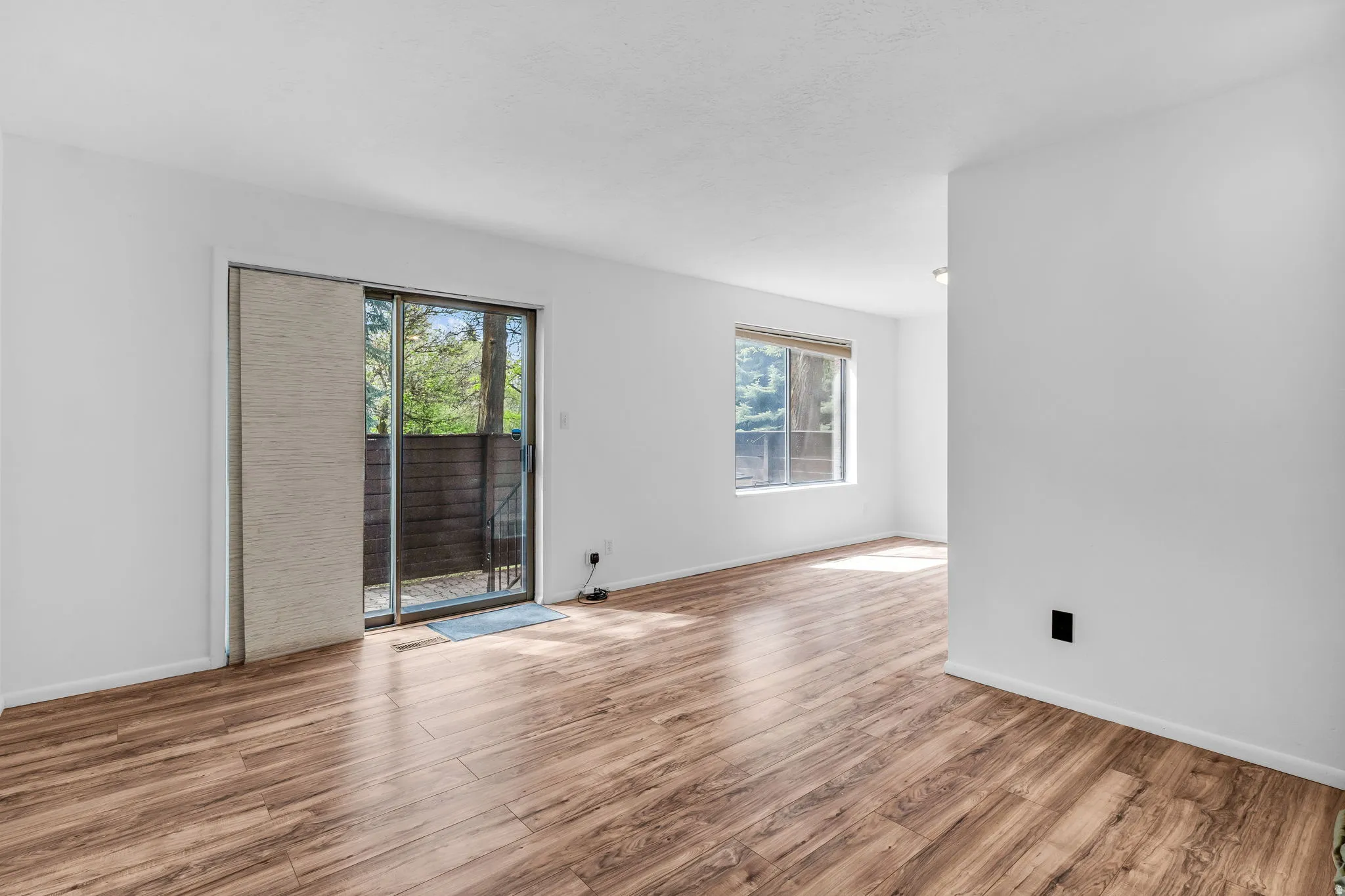 Unfurnished room with light wood-style flooring and plenty of natural light