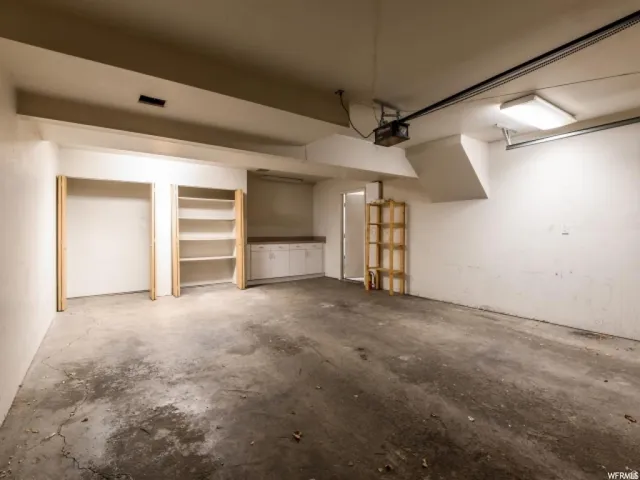 Garage featuring a garage door opener