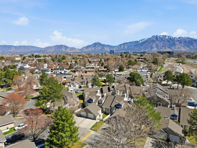 Aerial view of residential area featuring mountains