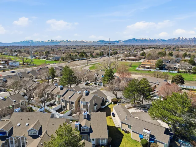 Aerial perspective of suburban area with a mountain backdrop