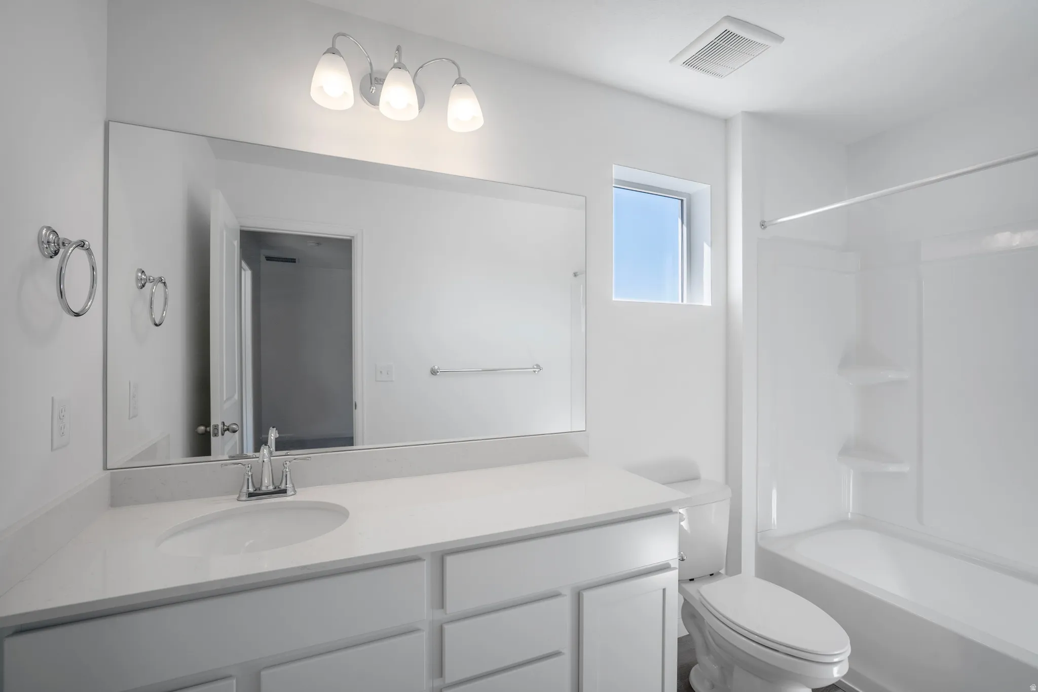 Bathroom featuring vanity and tub / shower combination