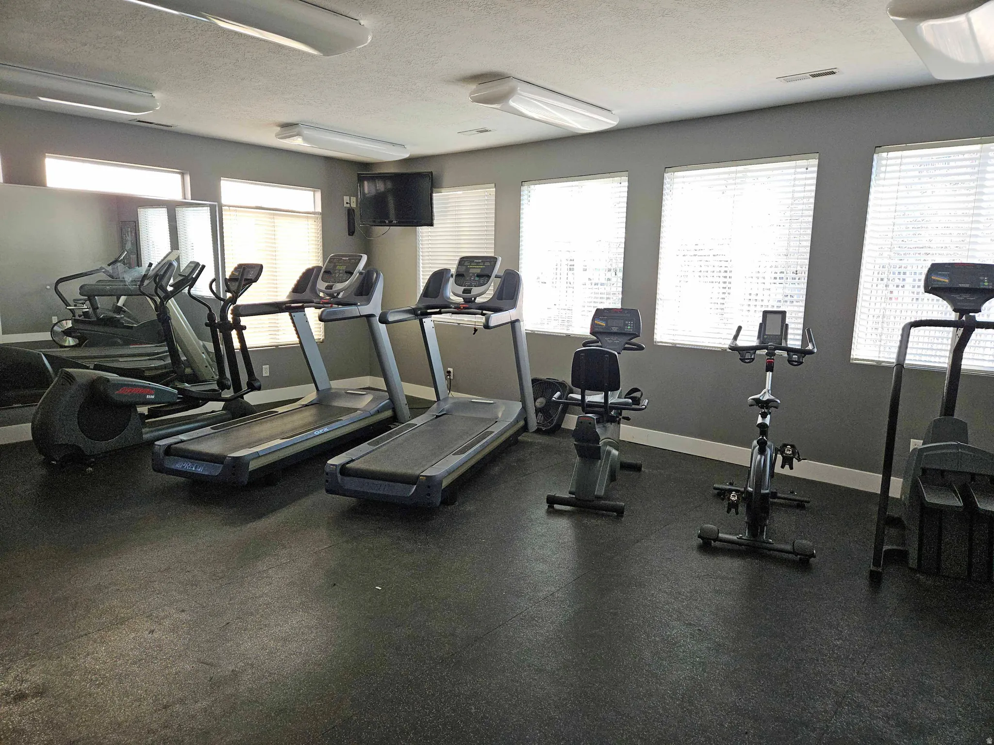 Workout area with a textured ceiling