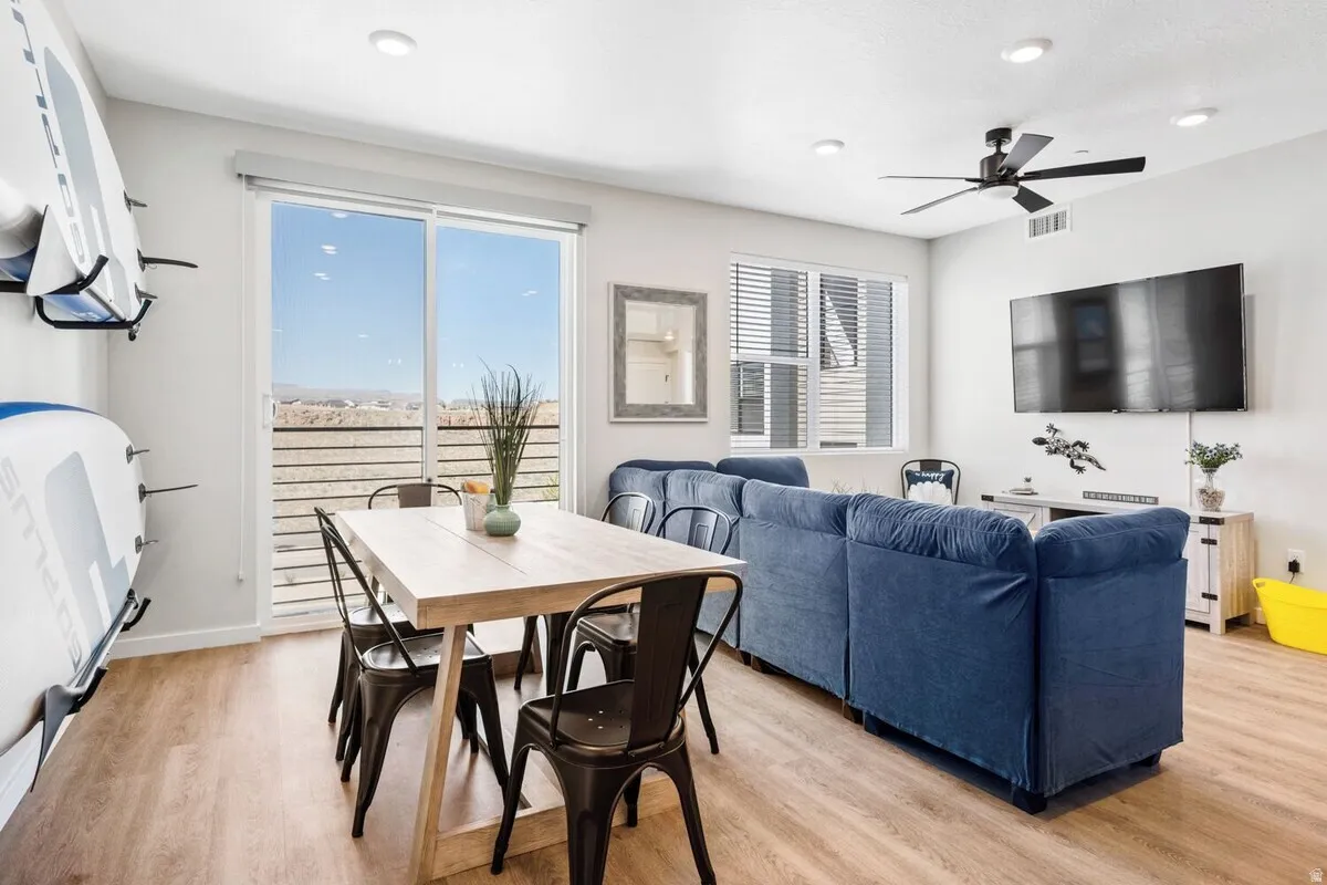 Dining area featuring light wood-style flooring, recessed lighting, and a ceiling fan