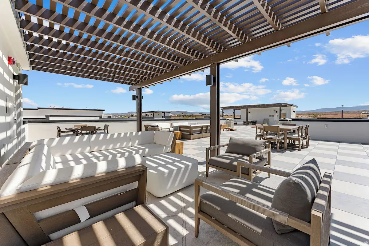 View of patio featuring outdoor dining area, an outdoor living space, a pergola, and a mountain view