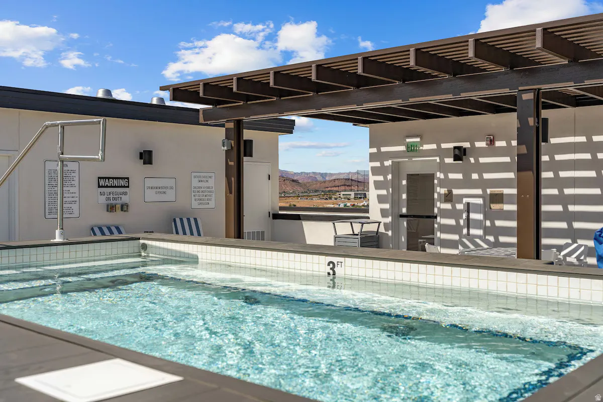 Community pool featuring a mountain view