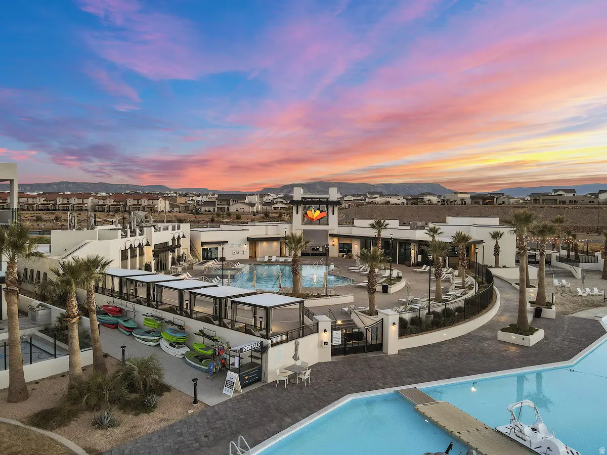 Community pool with a mountain view and a patio area