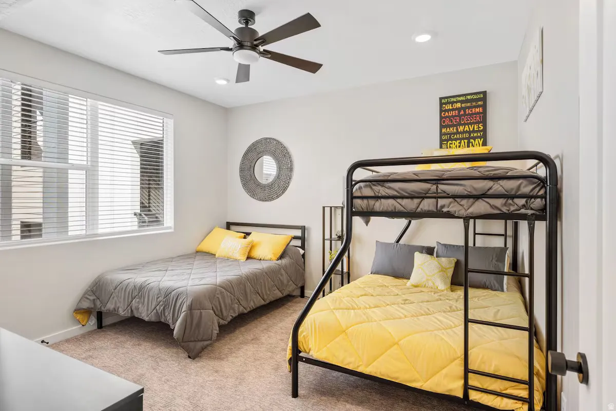 Bedroom featuring carpet floors, a ceiling fan, and recessed lighting