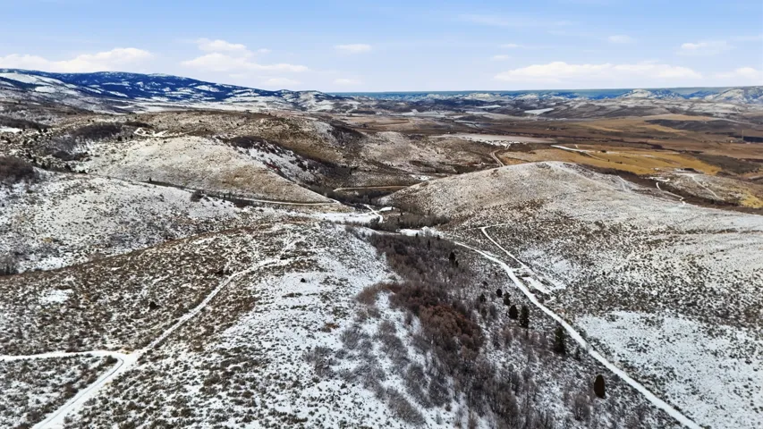 Snowy aerial view with a mountain view