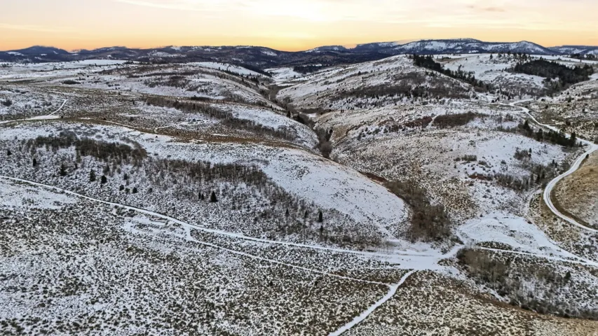 Snowy aerial view with a mountain view