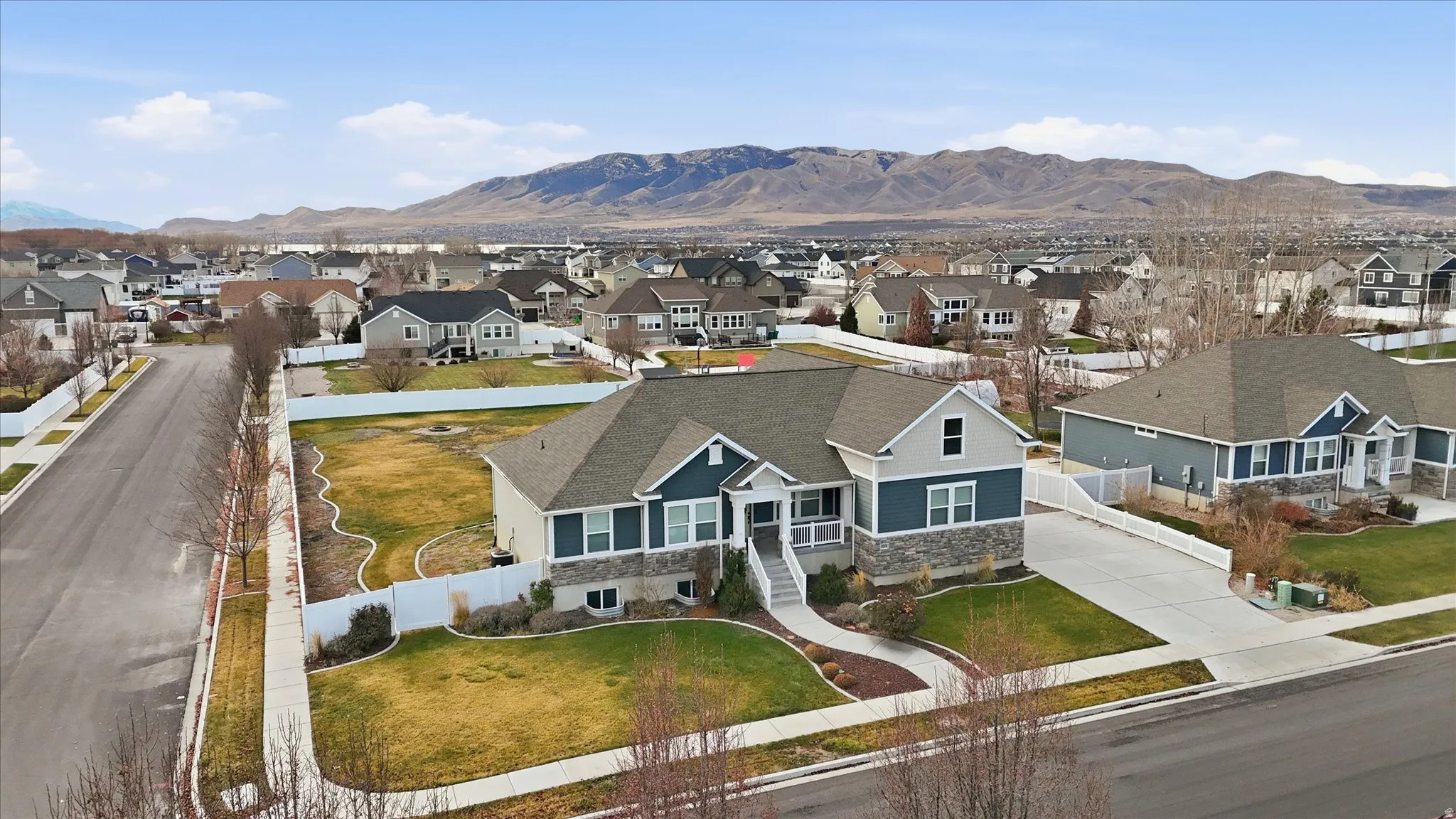 Aerial view of residential area featuring mountains
