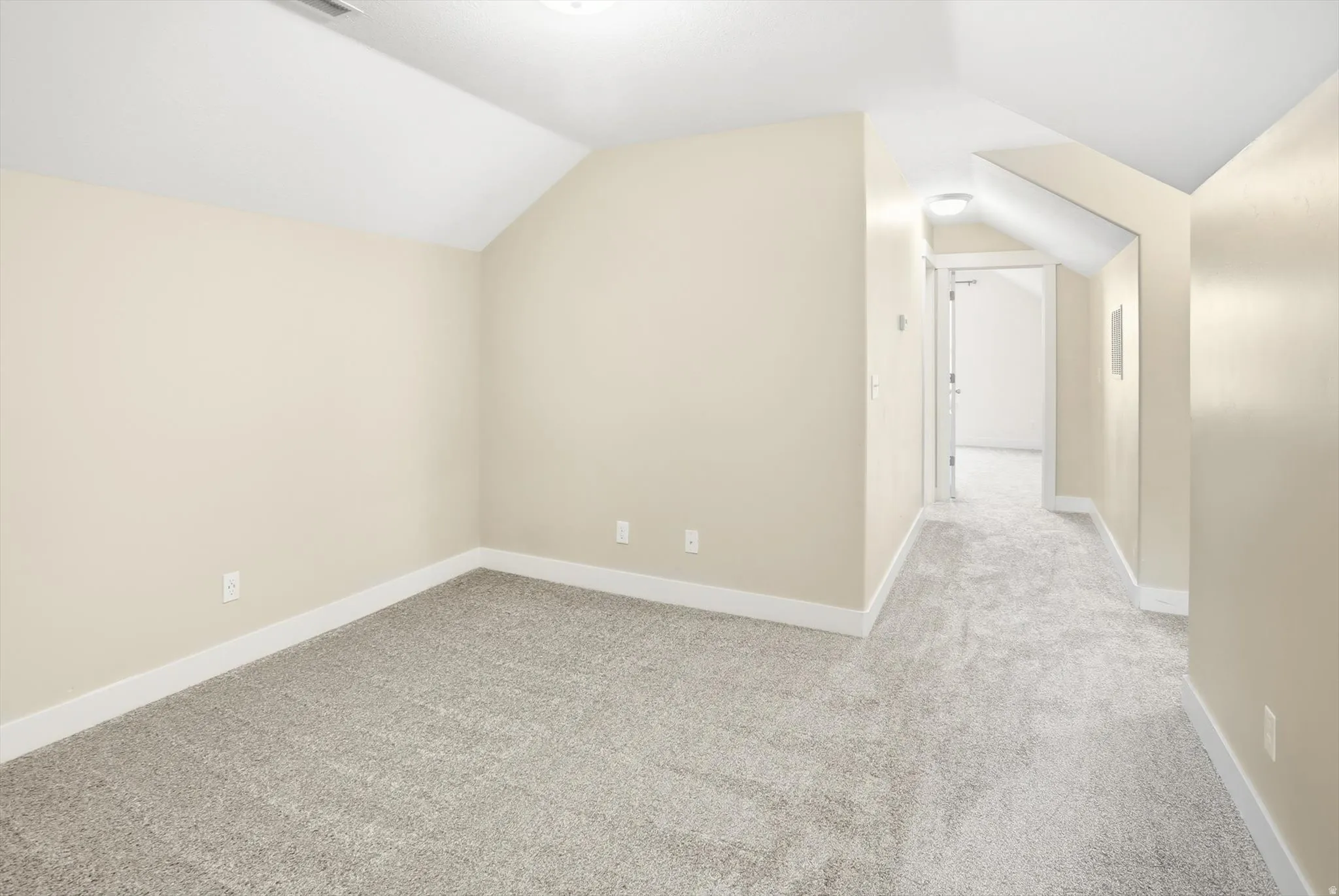 Bonus room featuring lofted ceiling and carpet on second floor