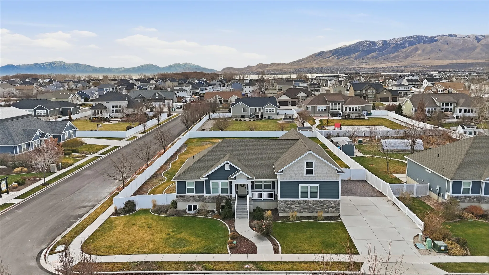 Aerial view of residential area featuring mountains