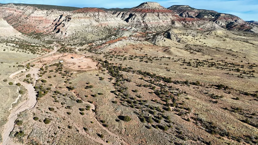 Expansive natural landscape with varied topography and distant mountainous formations